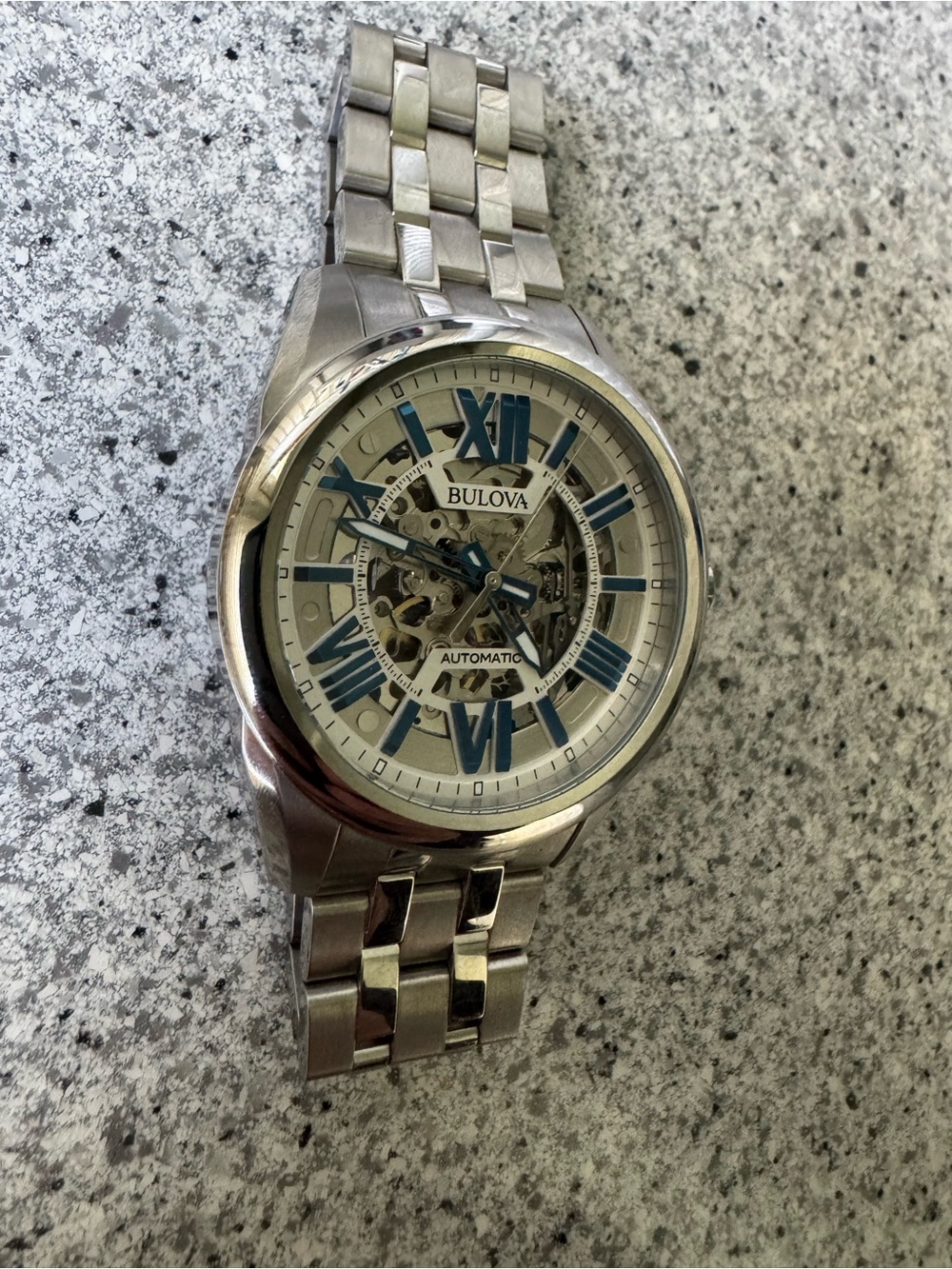 Bulova Silver Men's Skeleton Watch with Blue Accents
